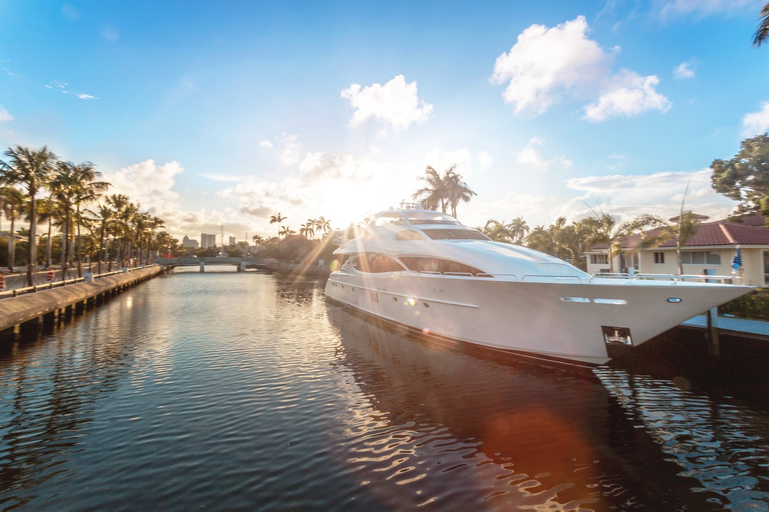 Boat surrounded by palm trees at the Miami International Boat Show