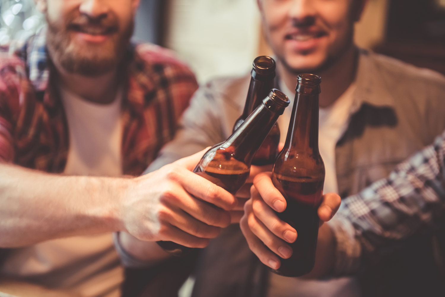 Friends toasting beer in hipster Fort Lauderdale