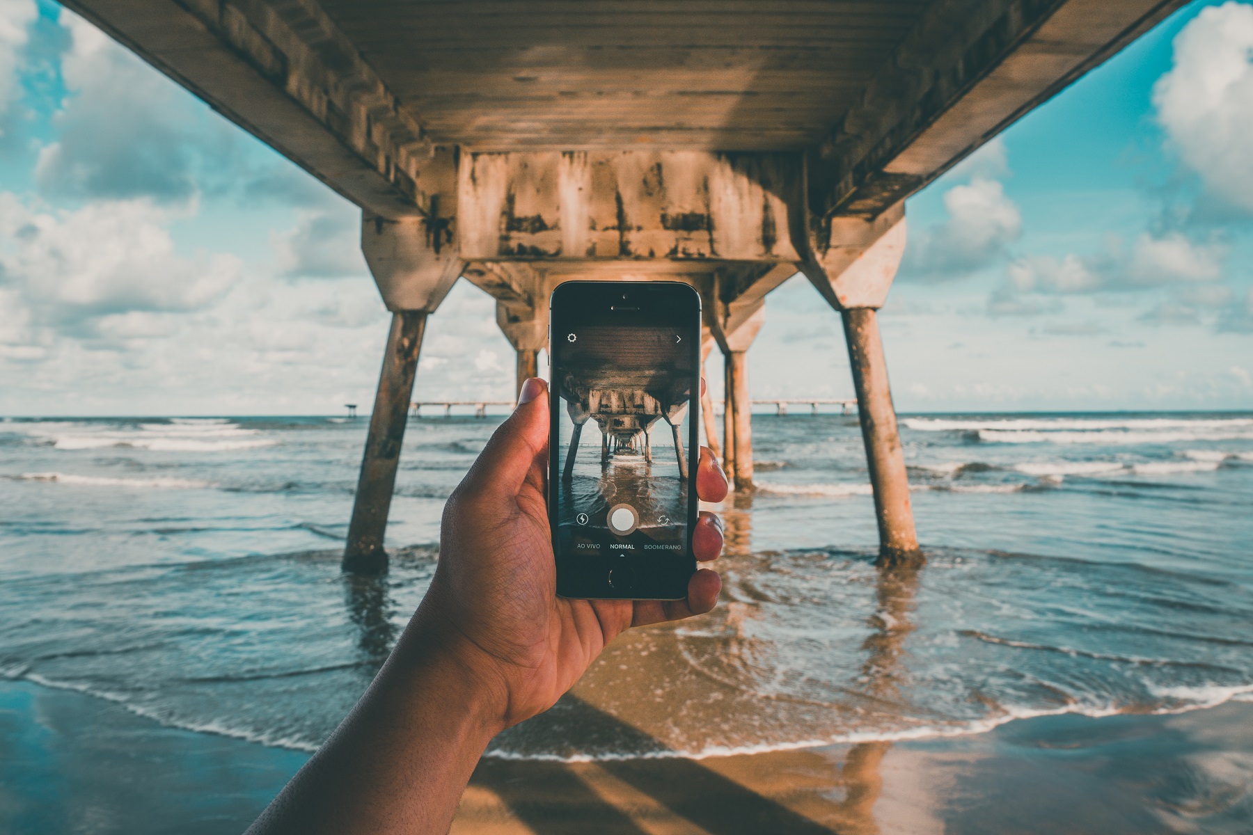 Person taking photo at the beach, one of the most Instagrammable places in Fort Lauderdale